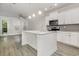 Modern kitchen island with granite countertops, stainless steel appliances, and gray flooring at 2409 Thoroughfare Dr. # 2409, North Myrtle Beach, SC 29582