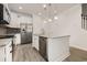 Bright kitchen featuring white cabinets, stainless appliances, granite counters, and an island with a stainless steel dishwasher at 2409 Thoroughfare Dr. # 2409, North Myrtle Beach, SC 29582