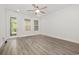 Open living room with ceiling fan, neutral color palette and stylish gray flooring at 2409 Thoroughfare Dr. # 2409, North Myrtle Beach, SC 29582