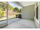 Covered porch area with concrete flooring and a view of the landscaped yard at 2409 Thoroughfare Dr. # 2409, North Myrtle Beach, SC 29582