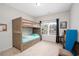 Neutral toned bedroom featuring a wooden bunk bed with built-in drawer storage and a carpeted floor at 250 Ole Maple St., Loris, SC 29569