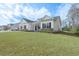 Beautiful home featuring a manicured lawn, stylish front porch and black shutters at 250 Ole Maple St., Loris, SC 29569