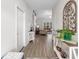 Inviting hallway featuring wood-look floors and views into the open living space at 250 Ole Maple St., Loris, SC 29569