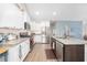 Modern kitchen featuring white cabinets, granite countertops, and stainless steel appliances at 250 Ole Maple St., Loris, SC 29569