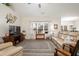 Spacious living room featuring large windows, a comfortable couch, and neutral decor at 250 Ole Maple St., Loris, SC 29569