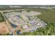Aerial view showcases a community with ponds, landscaping, and a centrally located pool at 2825 Mcdougall Dr., Conway, SC 29526