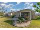 Well-maintained backyard with a manicured lawn, a screened porch and landscaping features at 2825 Mcdougall Dr., Conway, SC 29526