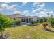 A lush green backyard, featuring mature trees and a screened porch for outdoor living at 2825 Mcdougall Dr., Conway, SC 29526