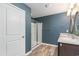 Well-lit bathroom featuring a glass-enclosed shower and double sink vanity at 2825 Mcdougall Dr., Conway, SC 29526