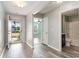 Inviting entryway with wood-look floors, neutral paint, and views to the bathroom, bedrooms and front door at 2825 Mcdougall Dr., Conway, SC 29526