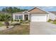 Inviting exterior view with manicured garden beds, showing the home's facade and entry at 2825 Mcdougall Dr., Conway, SC 29526
