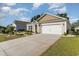 Charming single-story home showcasing a well-manicured lawn and a spacious two-car garage at 2825 Mcdougall Dr., Conway, SC 29526