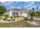 Well-maintained front yard with lush landscaping and a palm tree, adding to the home's curb appeal at 2825 Mcdougall Dr., Conway, SC 29526
