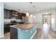 Modern kitchen with dark cabinetry, granite countertops, stainless steel appliances, and breakfast bar at 2825 Mcdougall Dr., Conway, SC 29526