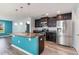 Well-equipped kitchen with dark cabinets, granite countertops, stainless steel appliances, and an island at 2825 Mcdougall Dr., Conway, SC 29526