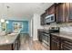 Modern kitchen featuring stainless steel appliances, granite countertops, and wood flooring at 2825 Mcdougall Dr., Conway, SC 29526