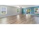 Spacious living room features wood-look floors, natural light, with sliding glass doors at 2825 Mcdougall Dr., Conway, SC 29526