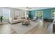 Stylishly furnished living room with wood-look flooring, sliding doors, and an abundance of natural light at 2825 Mcdougall Dr., Conway, SC 29526