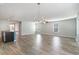 Expansive living space with wood-look floors, decorative lighting and seamless flow to the kitchen area at 2825 Mcdougall Dr., Conway, SC 29526