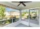 Cozy screened porch with ceiling fan offers views of the fenced backyard and landscaping at 2825 Mcdougall Dr., Conway, SC 29526