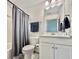 Bathroom featuring a shower with a curtain, a sink, and a toilet at 2858 Ellesmere Circle, Myrtle Beach, SC 29579