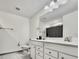 Bright bathroom featuring double sink vanity, toilet, and large mirror at 2858 Ellesmere Circle, Myrtle Beach, SC 29579