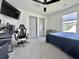 Comfortable carpeted bedroom with a gaming chair and dark ceiling fan at 2858 Ellesmere Circle, Myrtle Beach, SC 29579