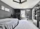 Modern bedroom featuring black walls, white trim, a ceiling fan and large window for natural lighting at 2858 Ellesmere Circle, Myrtle Beach, SC 29579