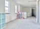 Bright and spacious bonus room with neutral colored walls and floors perfect for recreation and play at 2858 Ellesmere Circle, Myrtle Beach, SC 29579
