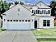 Charming two-story home with a two-car garage, dark shutters and a well-manicured lawn at 2858 Ellesmere Circle, Myrtle Beach, SC 29579