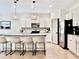 Spacious kitchen features granite countertops, stainless steel appliances, and bar stool seating at 2858 Ellesmere Circle, Myrtle Beach, SC 29579