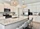 Modern kitchen with stainless steel appliances, granite counters, and a breakfast bar with seating at 2858 Ellesmere Circle, Myrtle Beach, SC 29579