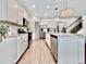 Modern kitchen with stainless steel appliances, granite counters, pendant lighting and hardwood floors at 2858 Ellesmere Circle, Myrtle Beach, SC 29579