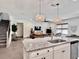 Open-concept kitchen with granite countertops, stainless steel appliances and stylish pendant lighting at 2858 Ellesmere Circle, Myrtle Beach, SC 29579