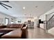 Bright, open living area with hardwood floors, comfortable leather seating and lots of light at 2858 Ellesmere Circle, Myrtle Beach, SC 29579