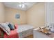 Cozy bedroom with stylish bedding, ceiling fan, and nautical themed decorations at 301 N Waccamaw Dr. # 110, Murrells Inlet, SC 29576