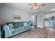 The living room features modern decor and a slider to an outside balcony overlooking a street at 301 N Waccamaw Dr. # 110, Murrells Inlet, SC 29576