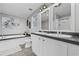 Bathroom with dual sinks, bathtub, and shower, complemented by stylish decor and modern fixtures at 3175 Lyndon Dr., Little River, SC 29566