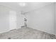 Bright bedroom with light gray walls and vinyl flooring. Perfect for a serene retreat at 3175 Lyndon Dr., Little River, SC 29566