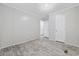 Neutral-colored bedroom with modern flooring and an ensuite bathroom is bright and airy at 3175 Lyndon Dr., Little River, SC 29566