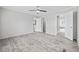 A light-filled bedroom offers wood-look flooring, neutral walls, and adjoining bathroom and closet at 3175 Lyndon Dr., Little River, SC 29566