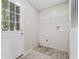 Cozy laundry room with a door to the outside and built in rack and shelving at 3175 Lyndon Dr., Little River, SC 29566