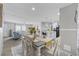 Open concept living space with dining area, kitchen, and comfortable sitting area at 3175 Lyndon Dr., Little River, SC 29566