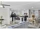 Modern kitchen with white cabinets and black appliances open to the dining and living spaces at 3175 Lyndon Dr., Little River, SC 29566