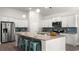 Modern kitchen with white cabinetry, granite countertops, stainless steel appliances, and island seating at 325 Wingspan Ct., Myrtle Beach, SC 29588