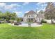 Expansive backyard with a pool, patio, fire pit, and lounge seating, perfect for entertaining at 3564 Brampton Dr., Myrtle Beach, SC 29588