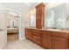 Bathroom featuring dual sinks and cabinetry with an open view of the main bedroom at 3564 Brampton Dr., Myrtle Beach, SC 29588