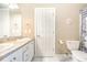 Bright bathroom featuring double sink vanity with granite counters and a decorative shower curtain at 3564 Brampton Dr., Myrtle Beach, SC 29588