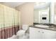 Inviting bathroom with dark granite counters, a vanity, and a shower with curtain at 3564 Brampton Dr., Myrtle Beach, SC 29588