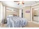 Bedroom featuring a ceiling fan, neutral walls, carpet floors, and ensuite bathroom access at 3564 Brampton Dr., Myrtle Beach, SC 29588